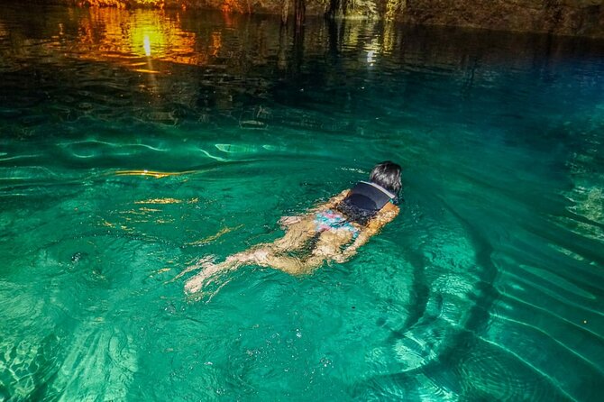 Adrenaline Tour with ATV, Ziplines and Cenote from Cancun - The cenote swim in a dark jungle setting