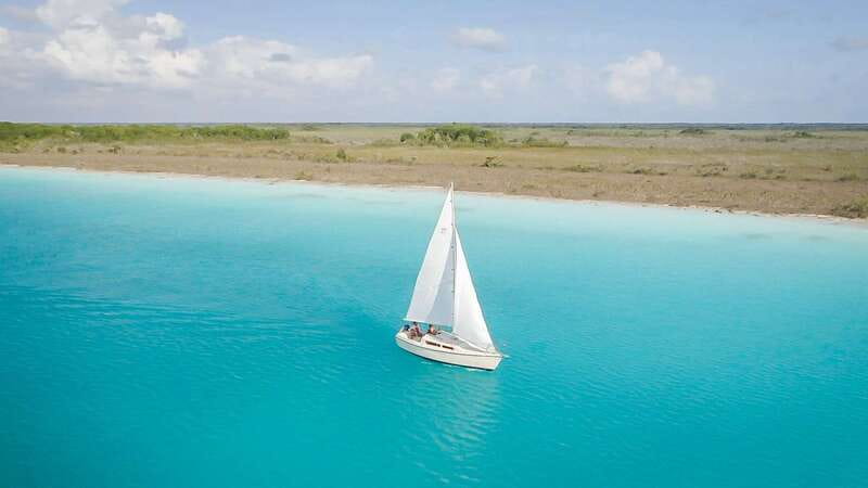 Bacalar: Group Sailing Trip with Swimming and Drinks - Cenote Esmeralda and the lagoon’s changing colors