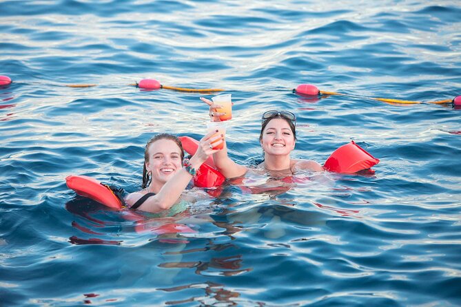 Cabo San Lucas Boat Tour with Snorkeling, Open Bar, and Lunch - Lunch, drinks, music, and games on the return