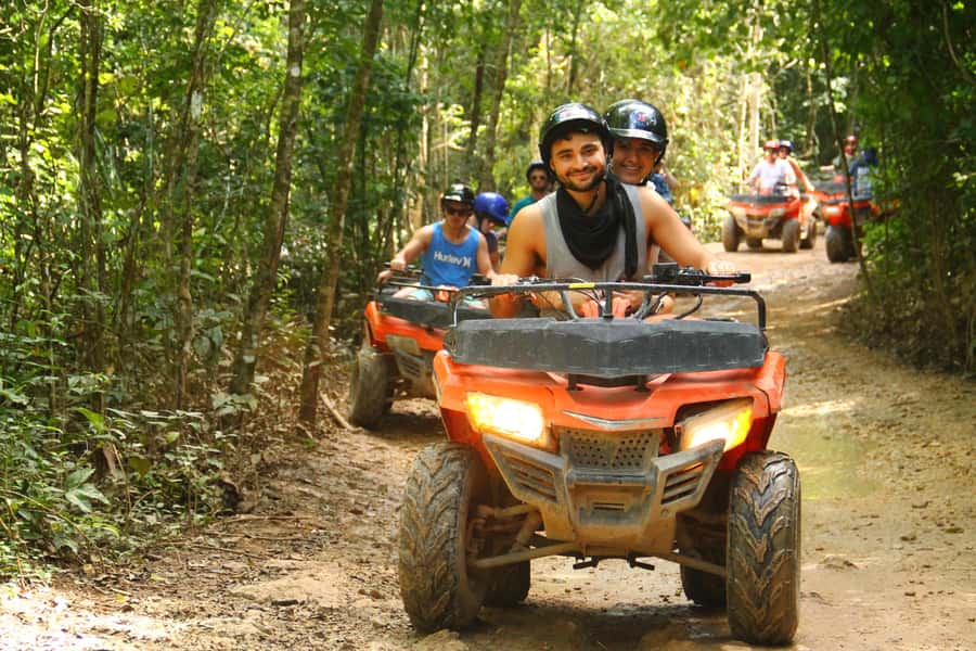 Cancún: ATV, Zipline, and Cenote Adventure with Lunch - Ziplining over the tree canopy