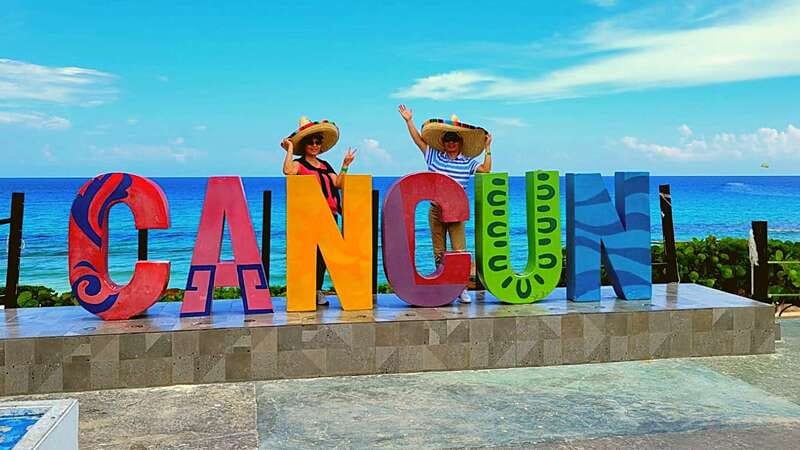 Cancun: Guided City Tour with Shopping by Double Decker Bus - Boulevard Kukulcan from the panoramic bus