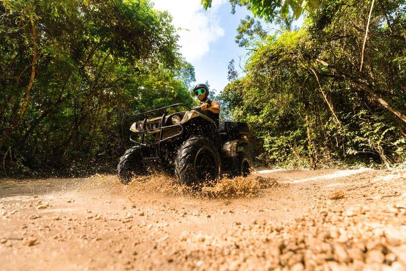 Cancun & Riviera Maya: ATV, Zipline, & Cenote Combo Tour - ATV riding through thick jungle