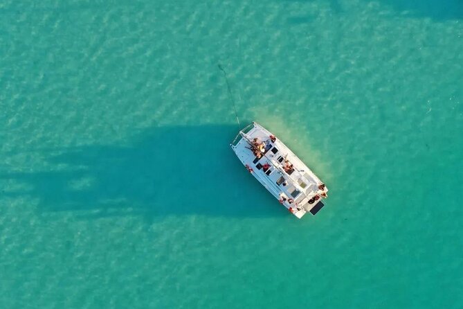 Catamaran Adventure: Sailing and Swimming in the Bacalar Lagoon - Fruit, drinks, and music on the water