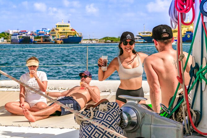 Catamaran to Isla Mujeres Snorkeling Tour with Open Bar and Lunch - Spinnaker, drinks, and the catamaran atmosphere