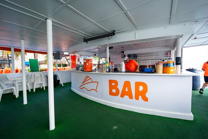 Dancer Cruise Isla Mujeres Snorkel Food and Drinks Included - The slide, trampoline, and open-water swim
