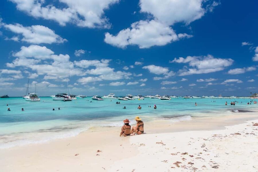 Isla Mujeres: Catamaran Ride with Open Bar, Snorkeling, and Lunch - Sailing from Cancun with music, sun, and room to relax