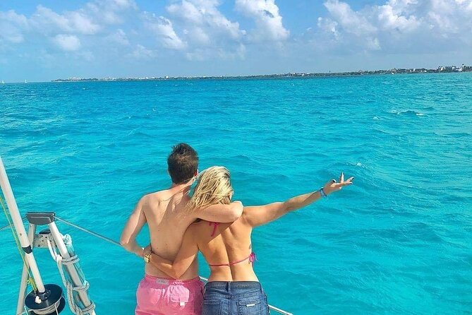 Isla Mujeres Catamaran Tour with Snorkel, Open bar and Transport - Timing, weather, and practical preparation