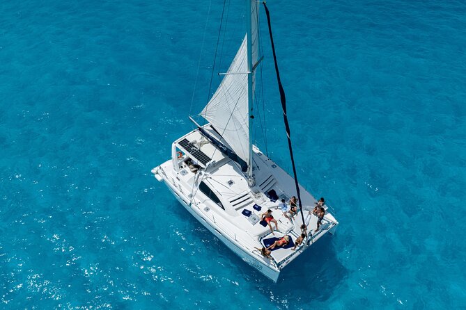 Isla Mujeres Day Tour with Catamaran, Snorkeling & Beach Club - Setting sail from Marina Las Perlas