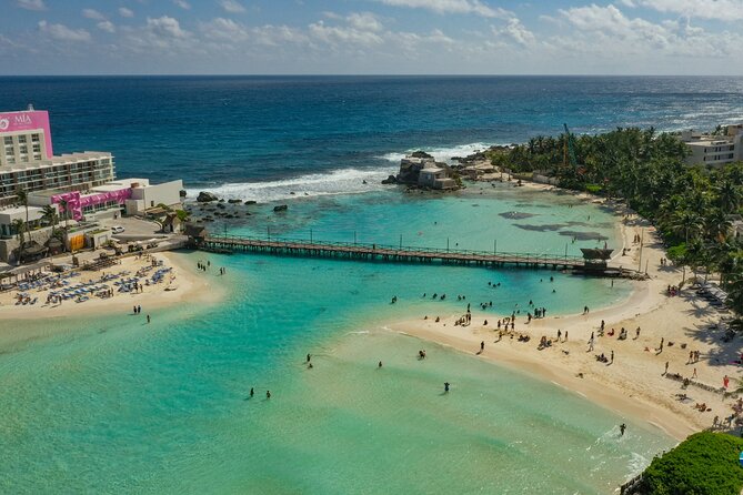Isla Mujeres Island and Snorkeling Tour - Playa Norte: clear water, crowded conditions
