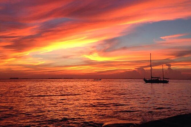 Isla Mujeres Sunset Cruise and Tour from Cancun - Crossing the Caribbean with drinks and a saxophone