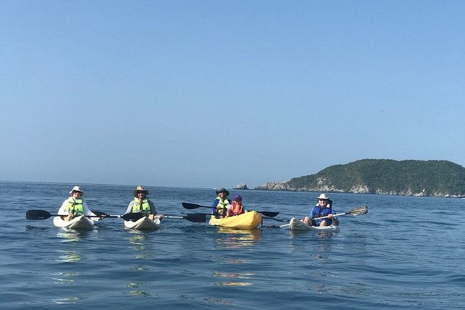 Las Gatas Kayaking and Snorkeling Tour - Crossing Zihuatanejo Bay by kayak