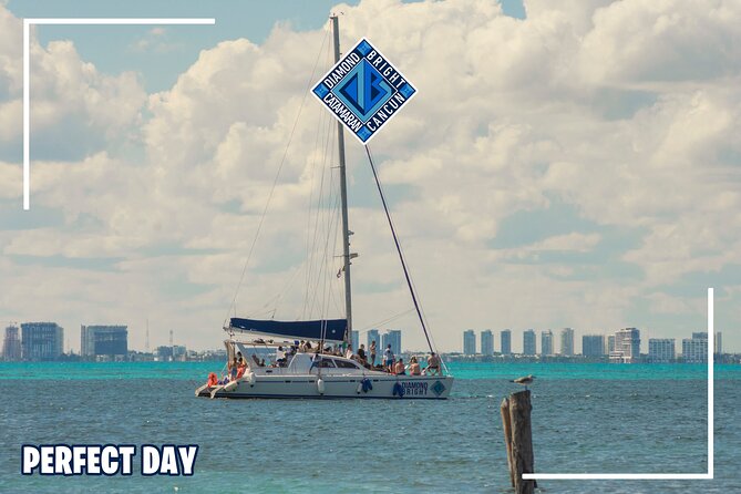 Luxury Catamaran tour to isla mujeres with transportation from Tulum - Swimming, clear water, and the optional spinnaker
