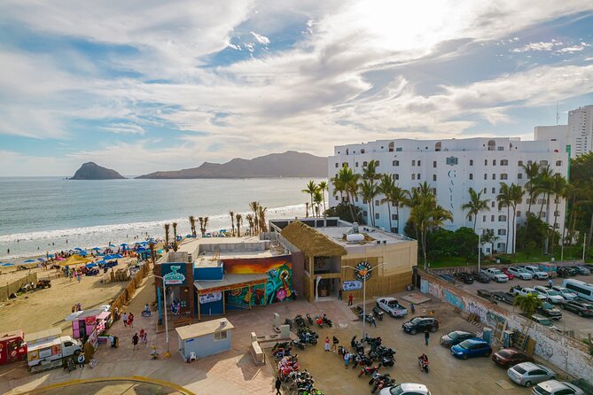 Mazatlan Sightseeing and Shopping Tour - Riding the malecón toward the beach