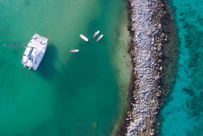 Riviera Maya Luxury Snorkeling Cruise with Lunch and Drinks - Paddleboards, floating mats, and the second water stop