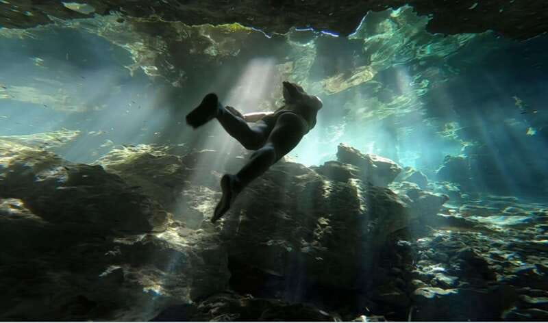 Riviera Maya: Tulum Ruins and 2 Cenotes Half-Day Tour - Walking into Tulum’s coastal Maya city