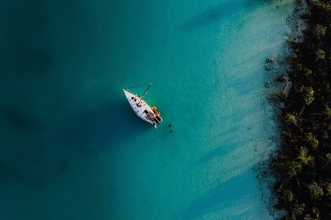 Sunset Sailing Tour in Bacalar with Outdoor Bar and Lunch - Cenote Esmeralda and the lagoon’s darker blue