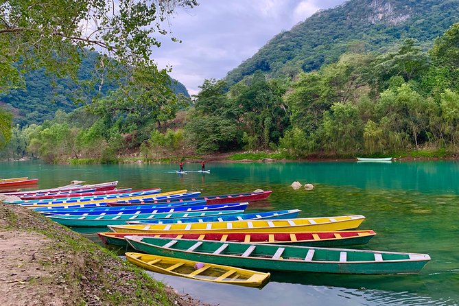 Tamul waterfall and water cave on a wooden canoe - Seeing Tamul Waterfall from the river