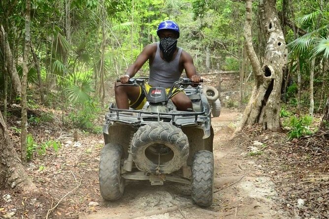 Tequila Tasting, Horseback Riding,ATV, Ziplines Cenote and Lunch - ATV riding on a dusty jungle circuit