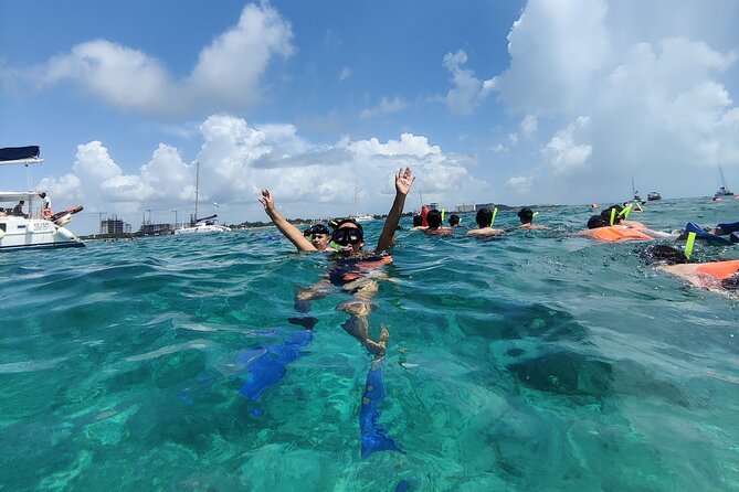 Top Isla Mujeres Catamaran Tour with Snorkel Open Bar and Buffet lunch - Boarding the catamaran in Cancun