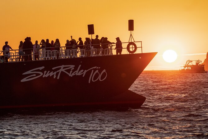 Whale Watching Dinner Cruise in Cabo San Lucas - Boarding with a drink in hand